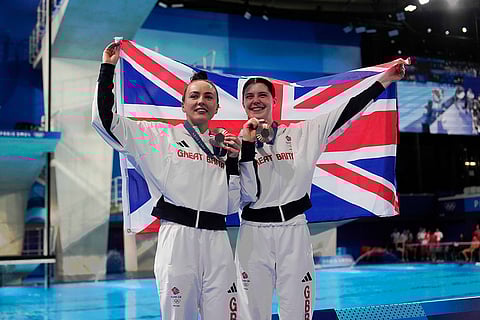 Britain's Andrea Spendolini Sirieix and Lois Toulson celebrates after winning the bronze medal